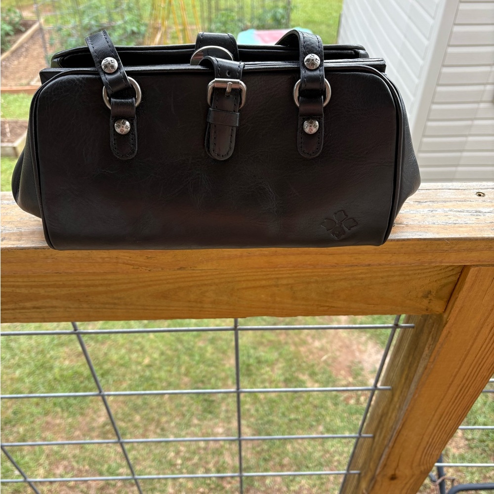 Black Leather Patricia Nash hand bag. Very clean inside. Plenty of organization